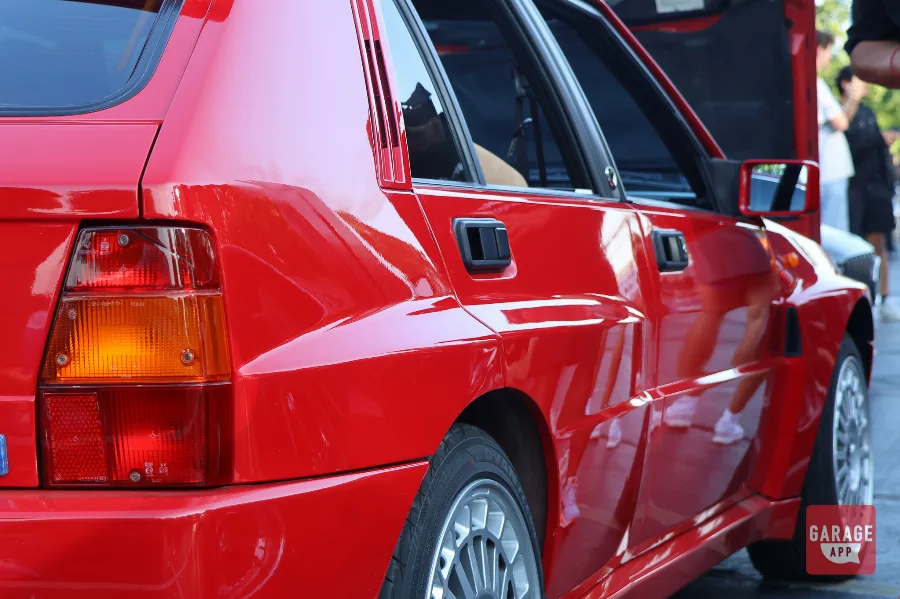 Red Lancia Delta HF Integrale rear quarter detail with Speedline wheel