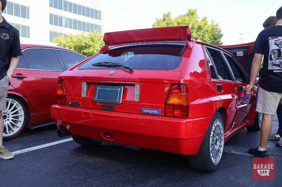 Red Lancia Delta HF Integrale rear three-quarter with spoiler and arches