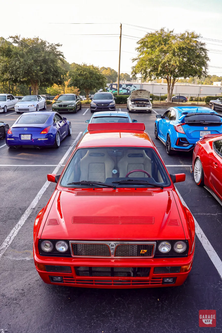 Elevated front view of red Lancia Delta HF Integrale at a car meet