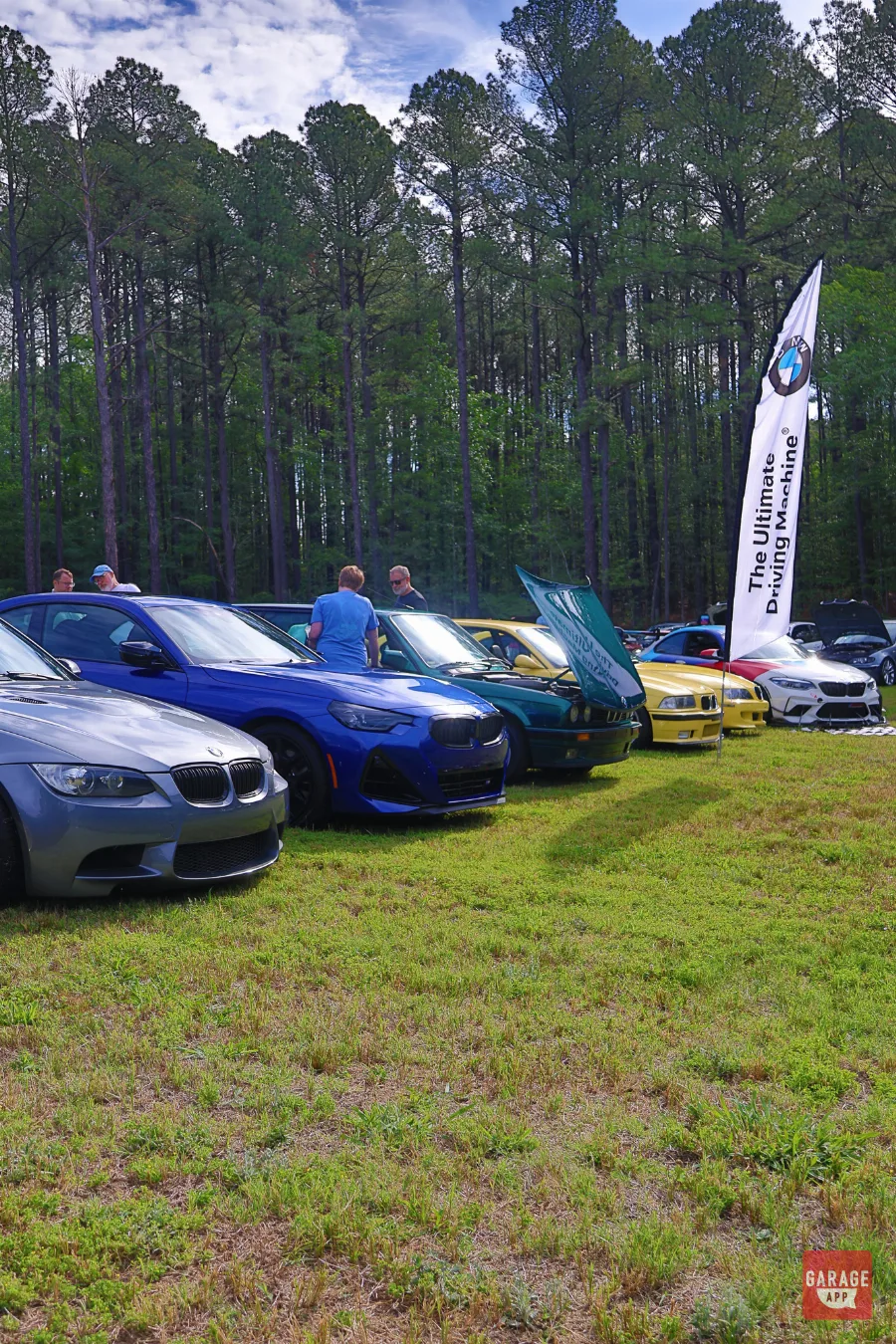 BMW community gathering featuring a diverse lineup of M cars, classics, and collector vehicles at a weekend automotive event.