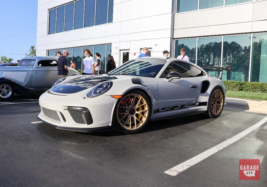 White Porsche 911 GT3 RS with gold wheels and red brake calipers at Cars and Coffee
