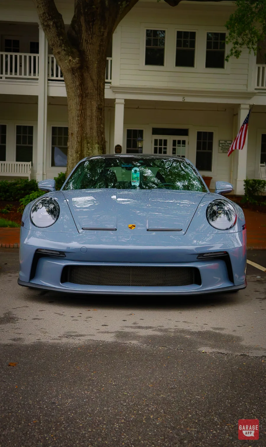 Porsche 911 GT3 Touring front view parked outside historic building in Pinehurst Village NC