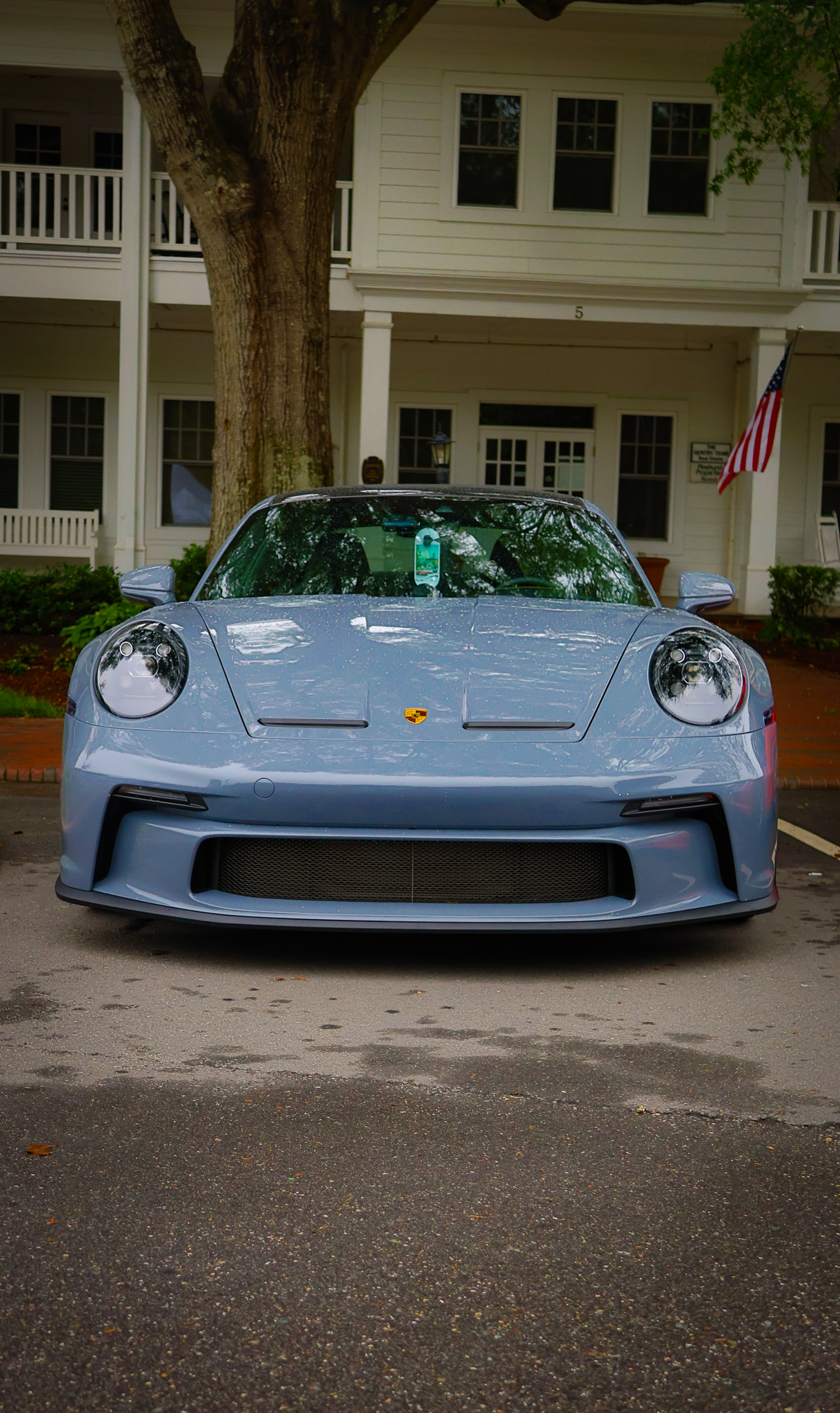 Porsche 911 GT3 Touring front view parked outside historic building in Pinehurst Village NC