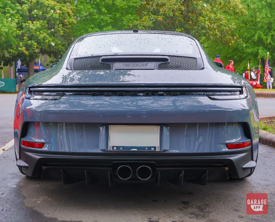 Porsche 911 GT3 Touring rear diffuser and center-exit exhaust close-up at Sandhills Expo