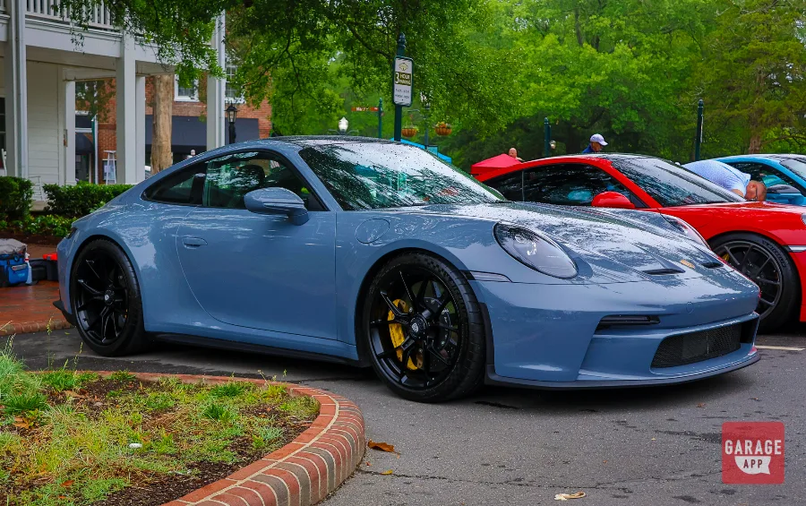 Slate blue Porsche 911 GT3 Touring front three-quarter view Sandhills Motoring Expo