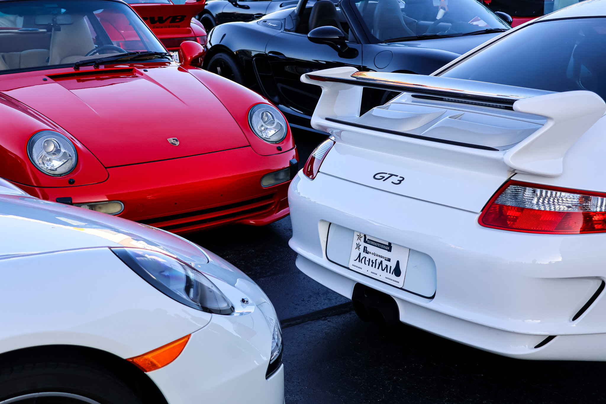 White Porsche 911 GT3 rear wing among 911 collection Raleigh meet