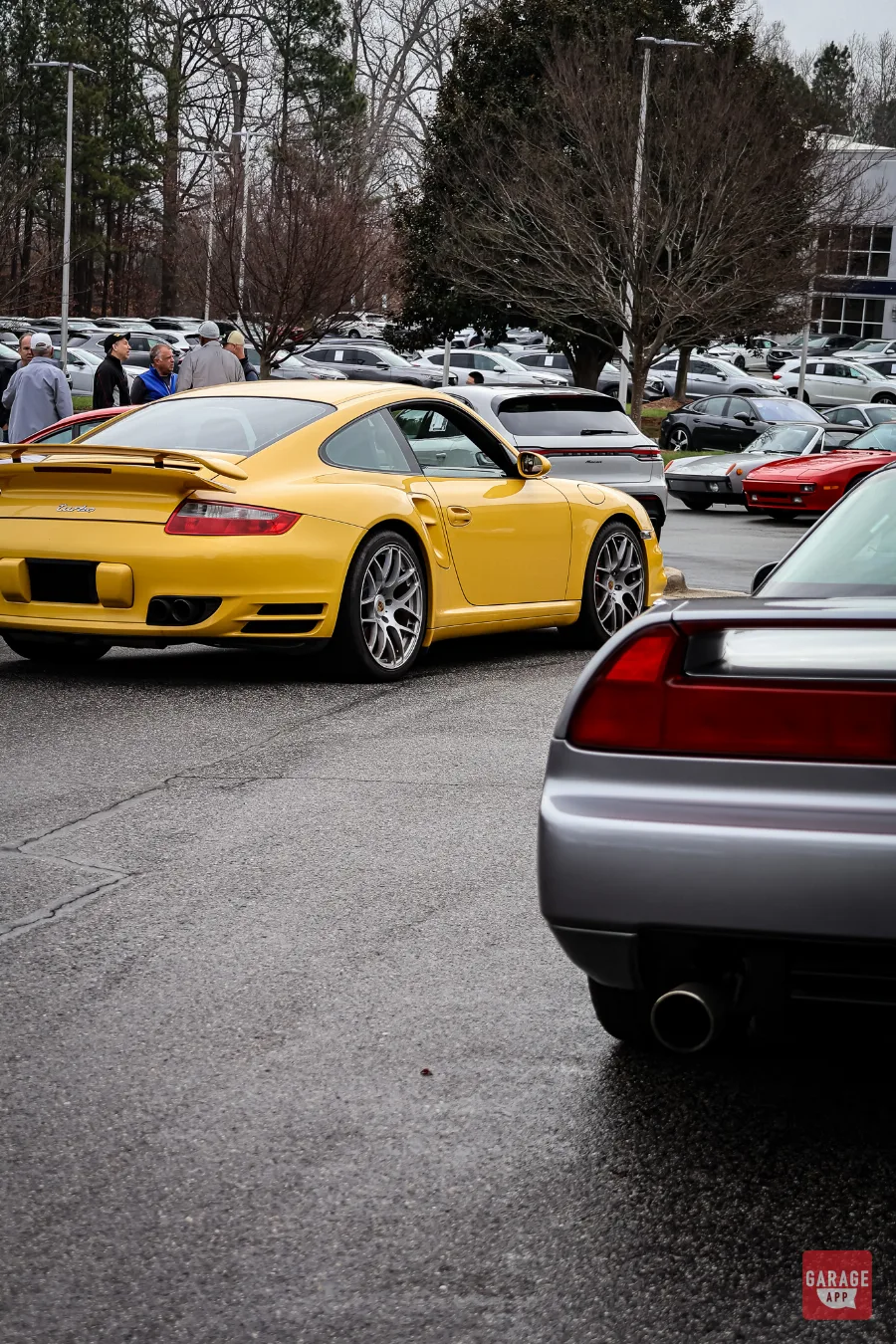 Yellow Porsche 911 Turbo 997 rear quarter view at Cars and Coffee