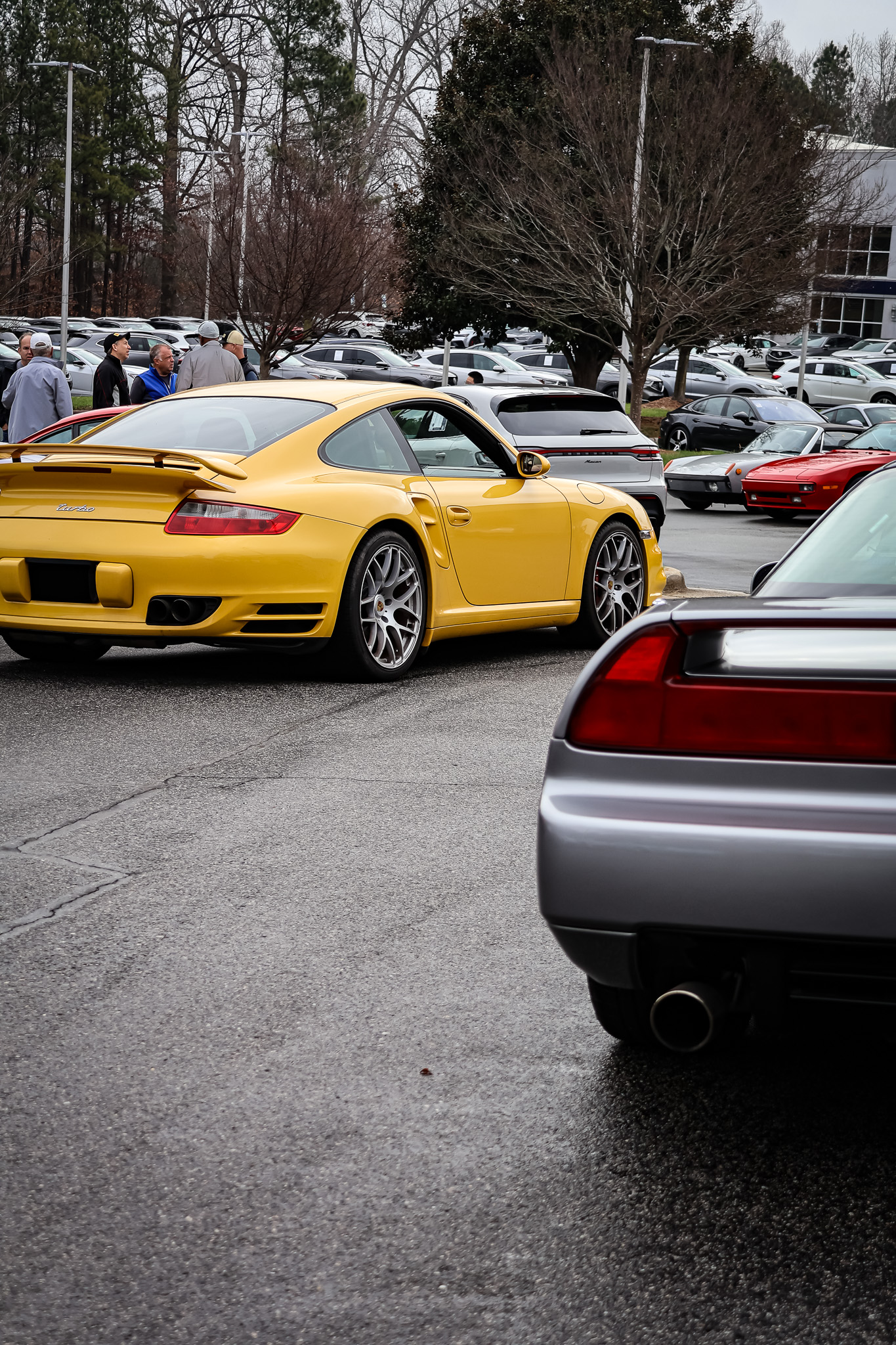 Yellow Porsche 911 Turbo 997 rear quarter view at Cars and Coffee