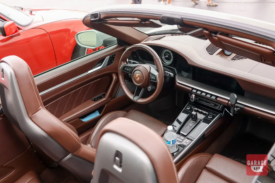 Porsche 911 Turbo S Cabriolet cognac leather interior and dashboard closeup