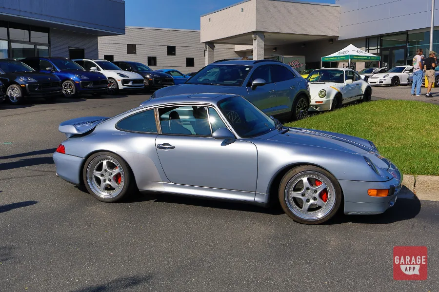 Silver widebody Porsche 993 Turbo with red calipers at VIR racing event