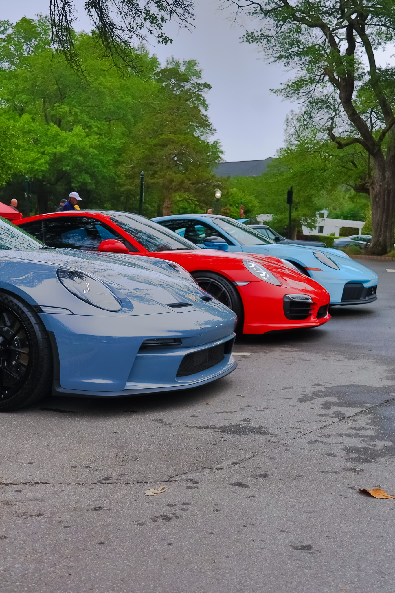 Porsche GT3 Touring lineup of three sports cars at Cars and Coffee Pinehurst NC