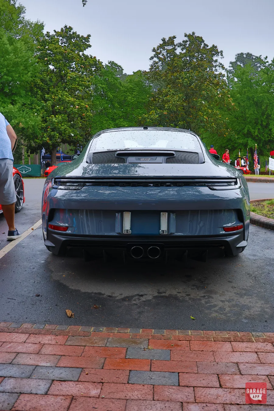 Porsche GT3 Touring rear view at car show Pinehurst North Carolina with brick walkway