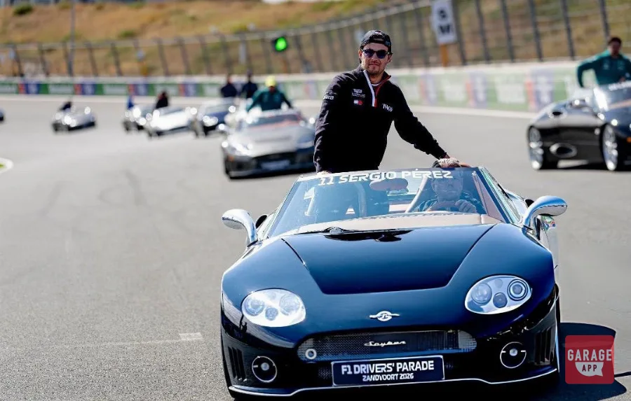 Sergio Pérez standing in black Spyker C8 during F1 Drivers' Parade Zandvoort 2026