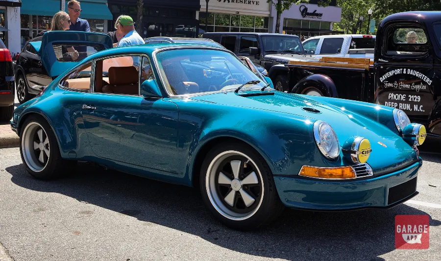 Front three-quarter view of a Singer Vehicle Design Porsche 911 showcasing classic air-cooled styling and modern engineering.