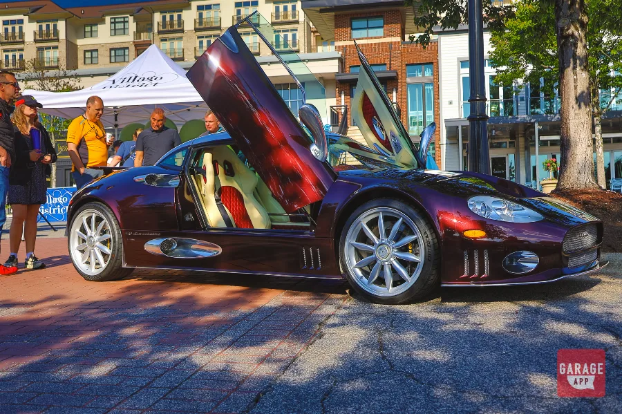 Madeira Red Spyker C8 butterfly doors open at Villago District show
