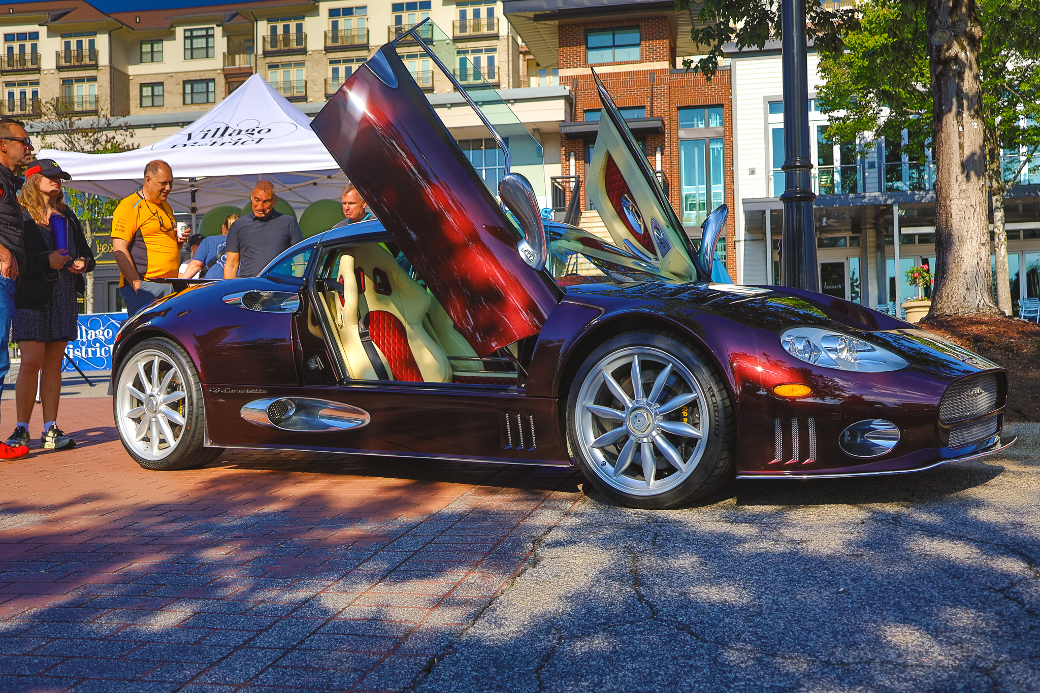Madeira Red Spyker C8 butterfly doors open at Villago District show